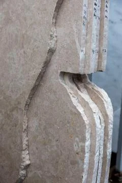 Side view of the edge of the granite slab in bulk. A stack of granite slabs - Stock Photos