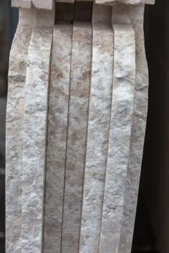 Side view of the edge of the granite slab in bulk. A stack of granite slabs - Stock Photos