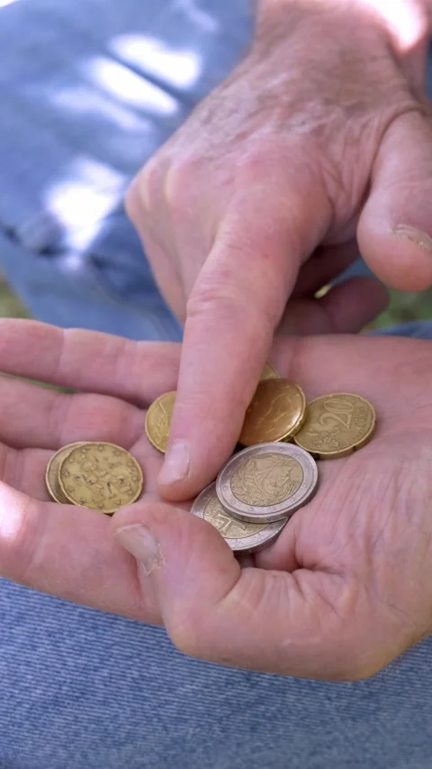 Side view elderly hands counting coins showing lack of money Stock Footage 333195130
