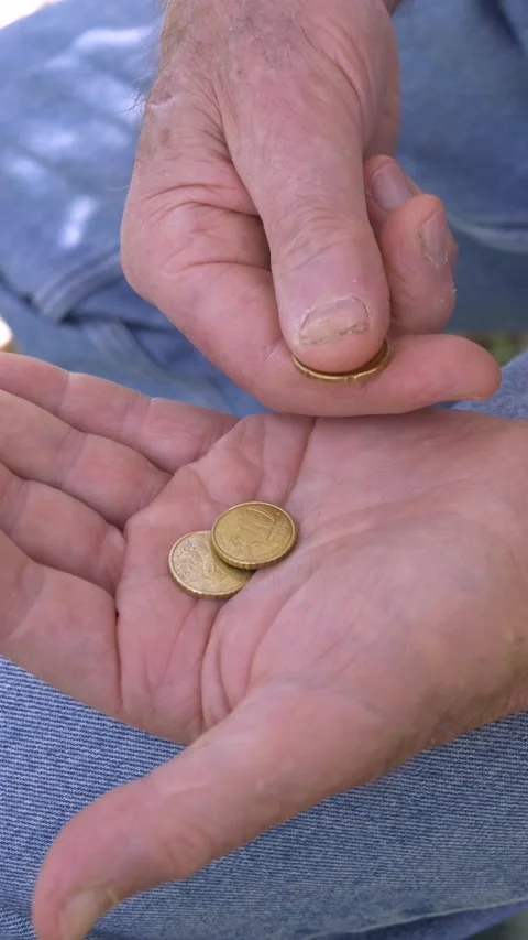 Side view elderly hands counting coins showing poverty and hardship Stock Footage 333195140
