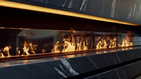 Side view on electric fireplace with artificial sparkling flame Stockbeeldmateriaal 239763402