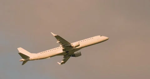 Side view of Embraer E195LR airplane ascending Stock Footage 167430094
