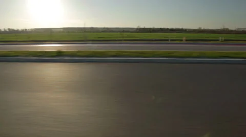 Side view on an empty highway towards the sun HD 30 fps Stock Footage 49108138