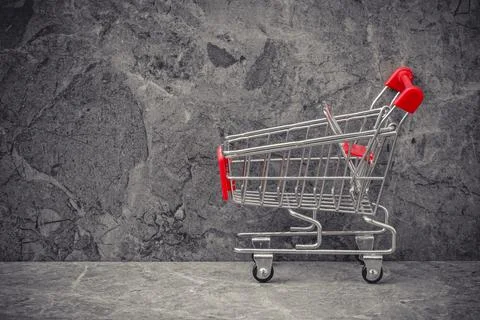 Side view of empty shopping cart or trolley Stock Photos