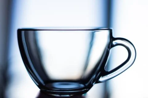 Side view of an empty transparent glass сup. Stock Photos