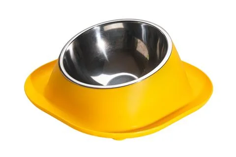 Side view of empty yellow water moat anti ant small dog and cat food bowl. Stock Photos