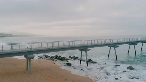 Side view of endless bridge stretch in ocean Stock Footage 102306415