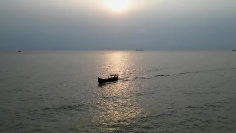 Side view of an engine-powered boat navigating through dirty, murky sea water Stock Footage 287779368