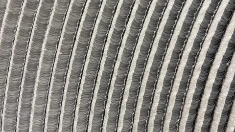 Side view of fabric winding from a textile machine Stock Footage 264959906