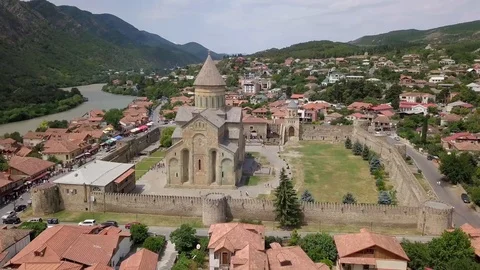 Side view of the famous Orthodox Cathedral Svetitskhoveli.Mountains,Aragvi River Video stock 106577232
