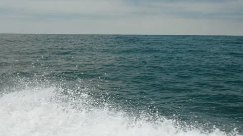 Side View from Fast Moving Boat off Dana Point California with Ocean Waves Crash Video stock 341447666