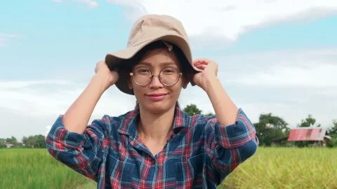 Side view of Female farmer standing in paddy field, portrait of woman farm worke Stock Footage 141352002