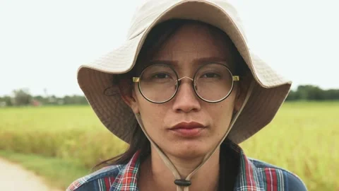 Side view of Female farmer standing in paddy field, portrait of woman farm worke Stock Footage 141355207