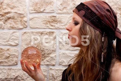 Side view of a female fortune teller Stock Photos