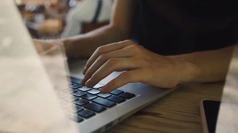 Side view female hands typing on a laptop keyboard 動画素材 127685252