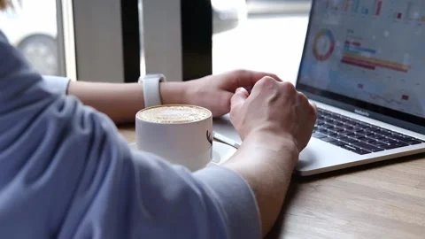 Side view of female hands typing on modern laptop keyboard making notes writing Stock Footage 265949288