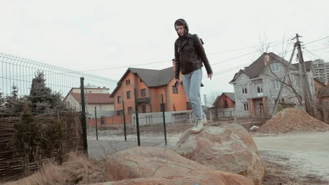 Side view of female legs jumping on rocks. Abstract scene of female legs Video stock 104731033