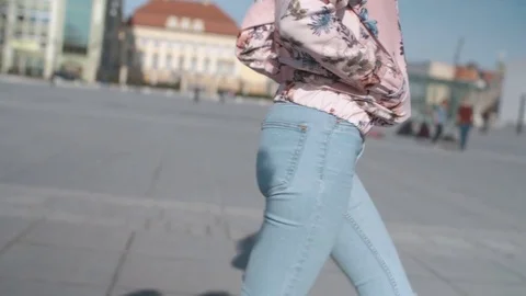 Side view of female legs walking in the city streets. Stock Footage 75399128
