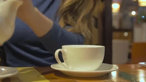 Side view of a female pouring tea Stock Footage 70659940