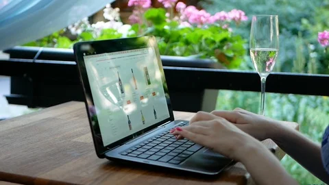 Side view of female using her laptop at a cafe. Overhead shot of young woman Video stock 100759933