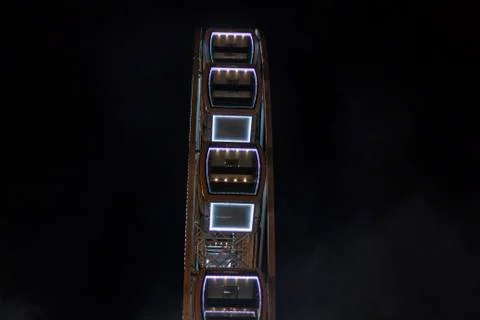 Side view of a ferris wheel spining Stock Photos