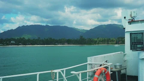 Side View from Ferry Boat on the Tropical Island. Red Lifebuoy. 4K Stock Footage 108626749