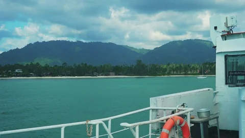 Side View from Ferry Boat on the Tropical Island. Red Lifebuoy. 4K Stock Footage 108626996
