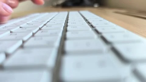 Side view of fingers pressing keyboard keys. Hands typing text during every.. Stock Footage 340284035