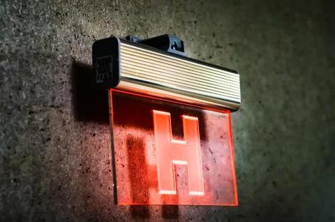 Side view of fire hydrant sign with glowing  red lights  on glass     hanging Stock Photos