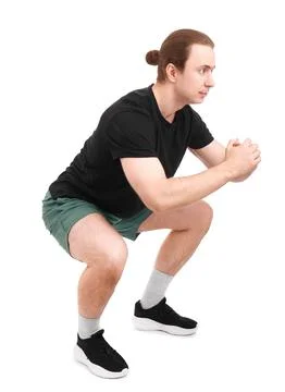 Side view of a fit man performing squat exercises isolated on white. Sporty.. Stock-Fotos