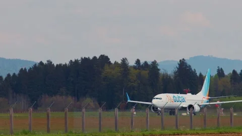 Side view of Flydubai passenger airplane taking off Stock Footage 201922162