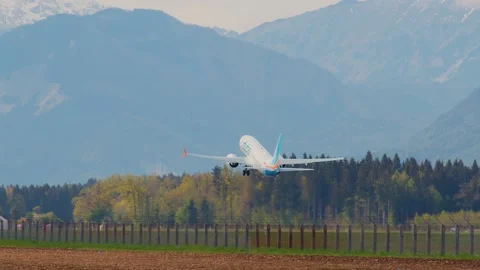 Side view of Flydubai passenger airplane taking off Stock Footage 201922504