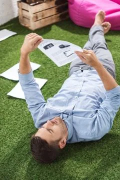 Side view of focused businessman analyzing documents, business establishment  Fotos Stock