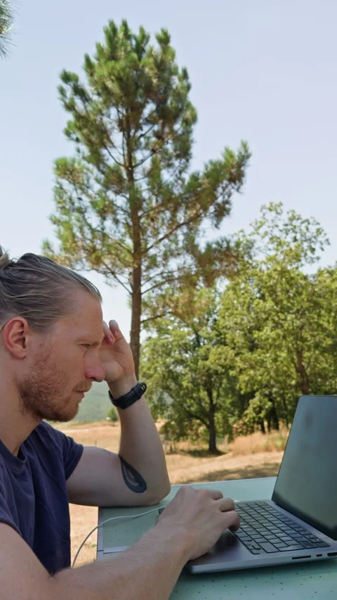 Side View of Focused Man Working on Laptop Video stock 344813947