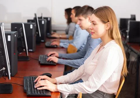 Side view of focused students working Stockfoto's