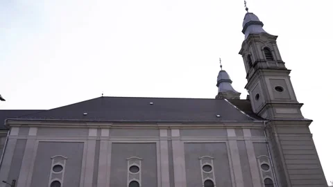 Side view footage of the local catholic bazilica in Csiksomlyo in hungarian Stock Footage 322922438