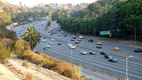 Side view of the freeway in Los Angeles near the Hollywood Bowl. Filmed at 4K Stock Footage 93246959