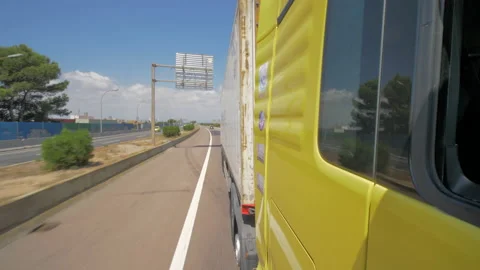 Side view of freight truck rolling on highway Stock Footage 143717897