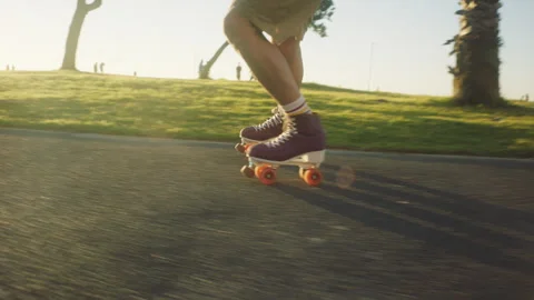 Side view of Friends Rollerskating on the street on a sunny day Stock Footage 279338810