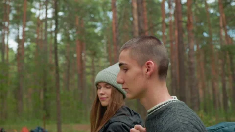 Side View Of Friends Walking Together Through Tranquil Forest Path Stock Footage 310468713
