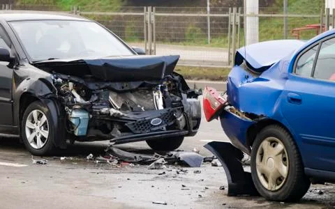 Side view. Front and Back of blue and dark color cars damaged and broken by acci Stock Photos
