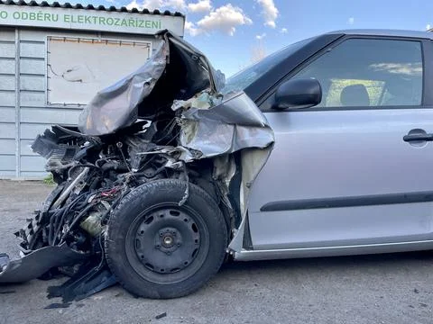 Side view of the front of a car badly damaged during a car accident. In this Stock Photos