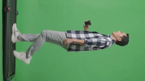 Side View Full Body Of Asian Man Walking And Drinking Coffee On Green Screen Stock Footage 248007587