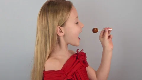 Side view funny cute little caucasian blond girl doing trick Stock Footage 126190495