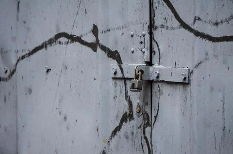 Side view of a garage lock on a gray garage. Stock Photos