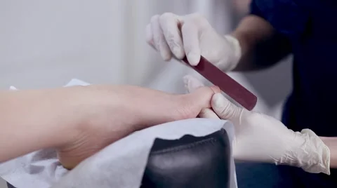 Side view of a gash toenails in salon Stock Footage 61234014