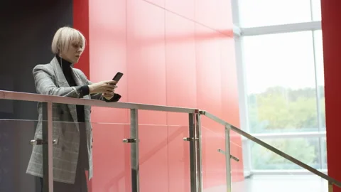 A side view general slow motion shooting of a younb business woman in the office Stock-Footage 135871751