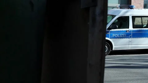 Side view of a German police van parked near the crime scene of the Stock Footage 172303015