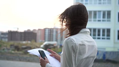 Side view of a girl with documents. Slow motion Stock Footage 141073865