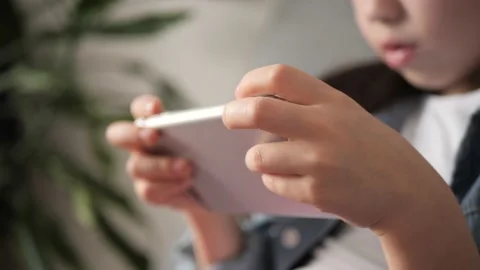 Side view of girl hands using smartphone in the living room at home, typing Stock Footage 168255723